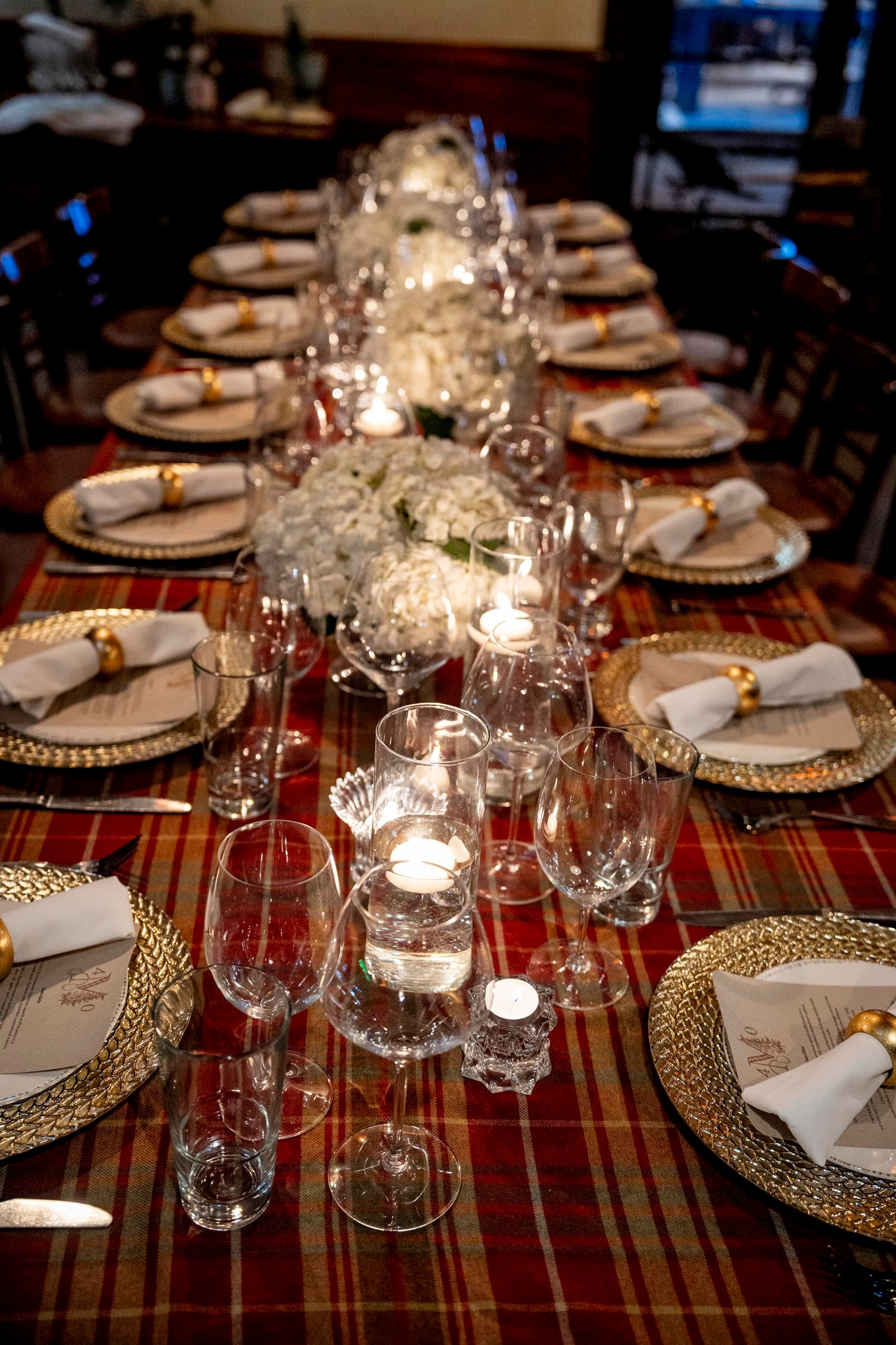 Intimate private dinner table with candlelight and florals